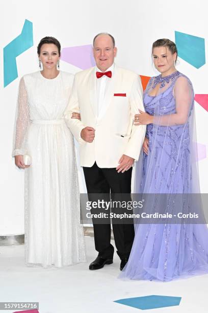Princess Charlene of Monaco, Prince Albert II of Monaco and Camille Gottlieb attend the Red Cross Ball 2023 on July 29, 2023 in Monaco, Monaco.