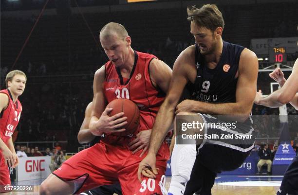 Maciej Lampe of Caja Laboral competes with Semih Erden of Anadolu Efes during the 2012-2013 Turkish Airlines Euroleague Regular Season Game Day 9...