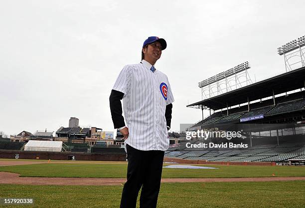 Chicago Cubs new pitcher Kyuji Fujikawa poses for photos on December 7, 2012 at Wrigley Field in Chicago, Illinois.