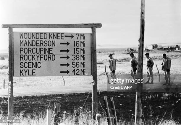 Federal troops block the road near Wounded Knee during the siege of the town on March 16 as about 200 American Indians occupe the town of Wounded...