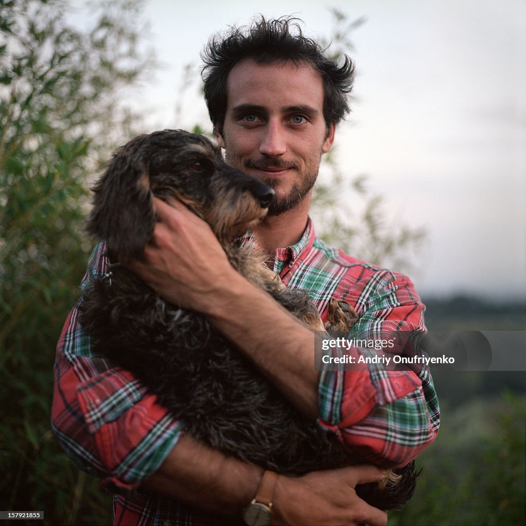 Man holding his dog