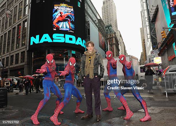 Reeve Carney, star of "SPIDER-MAN: Turn Off The Dark" and cast members ring the Opening Bell at NASDAQ MarketSite on December 7, 2012 in New York...