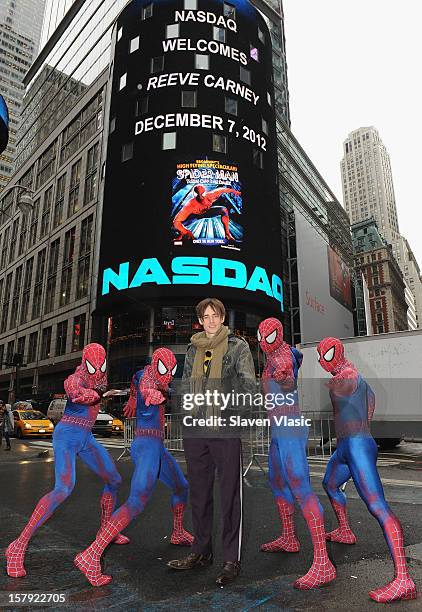 Reeve Carney, star of "SPIDER-MAN: Turn Off The Dark" and cast members ring the Opening Bell at NASDAQ MarketSite on December 7, 2012 in New York...