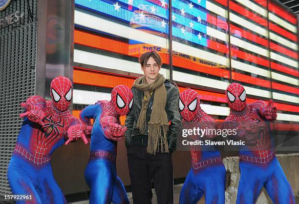 Reeve Carney , star of "SPIDER-MAN: Turn Off The Dark" and cast members ring the Opening Bell at NASDAQ MarketSite on December 7, 2012 in New York...