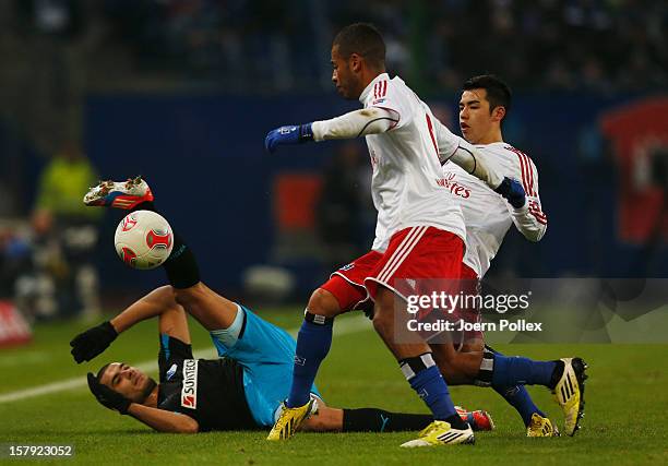 Dennis Aogo and Zhi Gin Lam of Hamburg and Eren Derdiyok of Hoffenheim compete for the ball during the Bundesliga match between Hamburger SV and TSG...