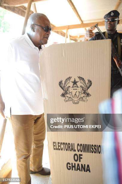 Ghana's ruling National Democratic Congress president and presidential candidate John Dramani Mahama arrives to cast his vote at the Bole polling...