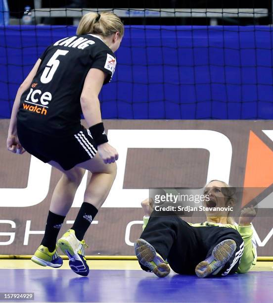 Katja Schulke and Saskia Lang of Germany celebrate during the Women's European Handball Championship 2012 Group C match between Croatia and Germany...
