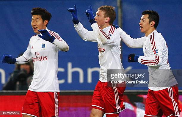 Artjoms Rudnevs of Hamburg celebrates with his team mates after scoring his team's second goal during the Bundesliga match between Hamburger SV and...