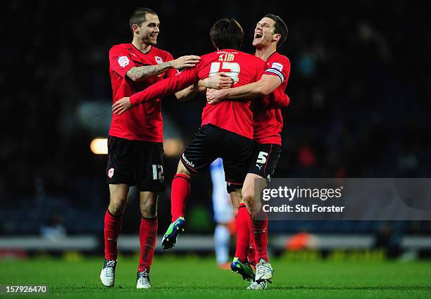 Cardiff players Matthew Connolly and Mark Hudson congratulate Kim Bo-Kyung on his goal during the npower Championship match between Blackburn Rovers...