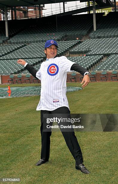 Chicago Cubs new pitcher Kyuji Fujikawa poses for photos on December 7, 2012 at Wrigley Field in Chicago, Illinois.