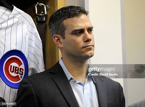 Theo Epstein, President of Baseball Operations for the Chicago Cubs watches as new pitcher Kyuji Fujikawa is introduced to the media on December 7,...