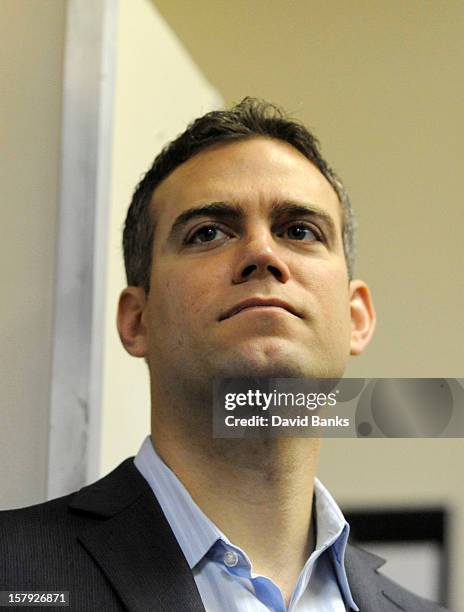 Theo Epstein, President of Baseball Operations for the Chicago Cubs watches as new pitcher Kyuji Fujikawa is introduced to the media on December 7,...