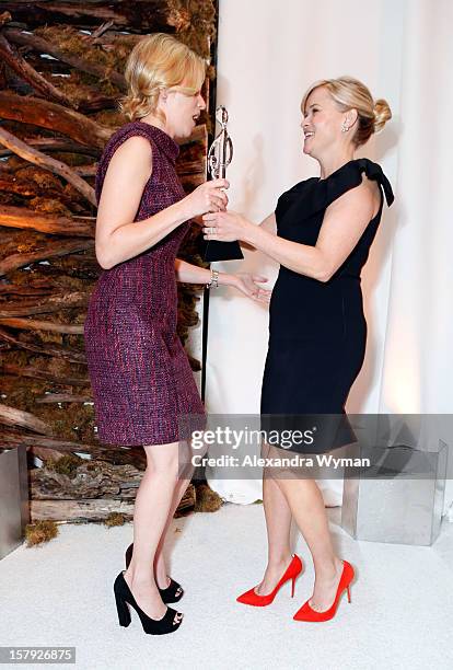 Honoree Reese Witherspoon accepts the Grace Kelly Award from presenter Elizabeth Banks onstage during the 7th Annual March of Dimes Celebration of...