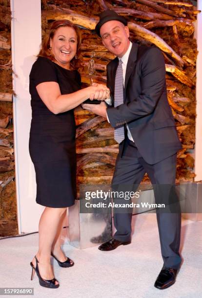Honoree Cyma Zarghami accepts the Inspiring Woman of the Year award from presenter Mike O'Malley onstage during the 7th Annual March of Dimes...