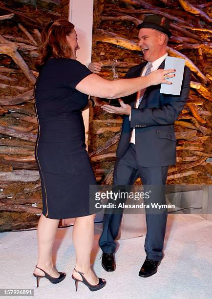 Honoree Cyma Zarghami accepts the Inspiring Woman of the Year award from presenter Mike O'Malley onstage during the 7th Annual March of Dimes...