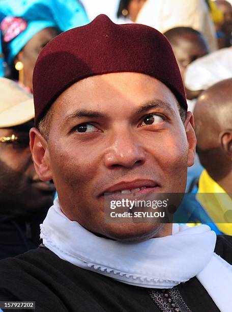 Karim Wade, son of former Senegalese president Abdoulaye Wade looks on during the Senegalese Democratic Party during a protest to denounce...