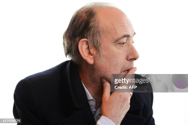 British singer and guitarist Mick Jones, founder of the band "The Clash", listens during a press conference as part of the 34th Trans Musicales music...