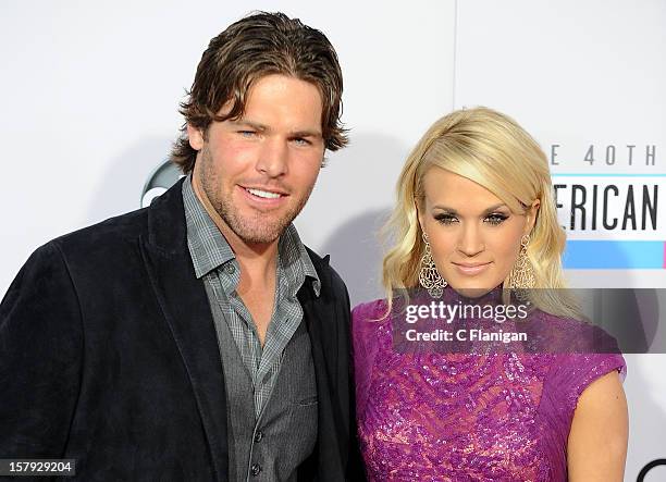 Carrie Underwood and husband Mike Fisher arrive at The 40th American Music Awards at Nokia Theatre L.A. Live on November 18, 2012 in Los Angeles,...