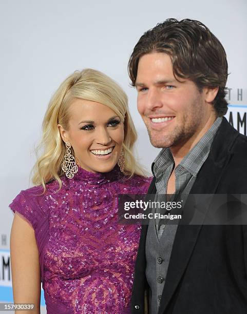 Carrie Underwood and husband Mike Fisher arrive at The 40th American Music Awards at Nokia Theatre L.A. Live on November 18, 2012 in Los Angeles,...