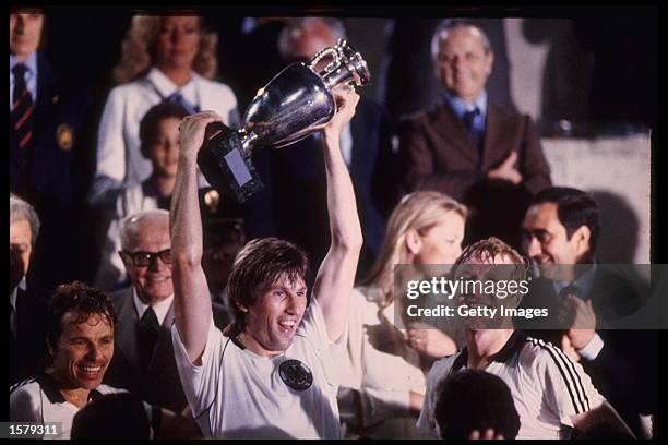 Manny Kaltz of West Germany hold aloft the European nations trophy after his team defeat Belgium in the Final of the Competition held in Rome, Italy....