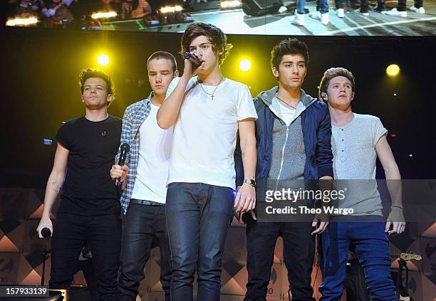 Louis Tomlinson, Liam Payne, Harry Styles, Zayn Malik and Niall Horan of One Direction perform onstage during Z100's Jingle Ball 2012, presented by...