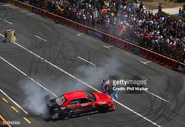 Daigo Saito of Japan competes in the Red Bull Drift Shifters along Victoria Street on December 8, 2012 in Auckland, New Zealand.