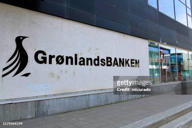 bank of greenland - sign with logo, nuuk, greenland - nuuk greenland stock pictures, royalty-free photos & images