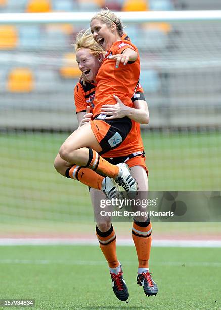 Katrina Gorry of the Roar celebrates with team mate Clare Polkinghorne after scoring a goal during the round eight W-League match between the...