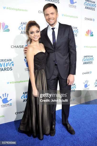 Actress Sarah Hyland and host Joel McHale arrive at the American Giving Awards presented by Chase held at the Pasadena Civic Auditorium on December...