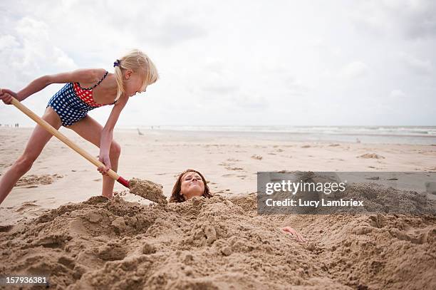sand mermaid making - bury fotografías e imágenes de stock