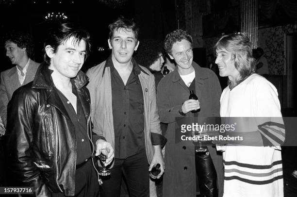 22nd SEPTEMBER: From left to right: Guitarist Chris Spedding, John Cale, Malcolm McLaren and guitarist Mick Ronson at a party for Cheap Trick at the...