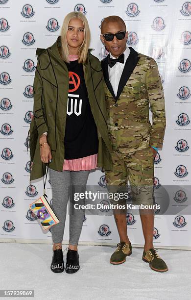 Helen Lasichanh and producer Pharrell Williams attend a private dinner celebrating Remo Ruffini and Moncler's 60th Anniversary during Art Basel Miami...