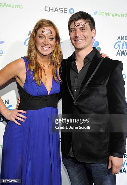 More Than Me" foundation founder Katie Meyler and guest arrive at the American Giving Awards presented by Chase held at the Pasadena Civic Auditorium...