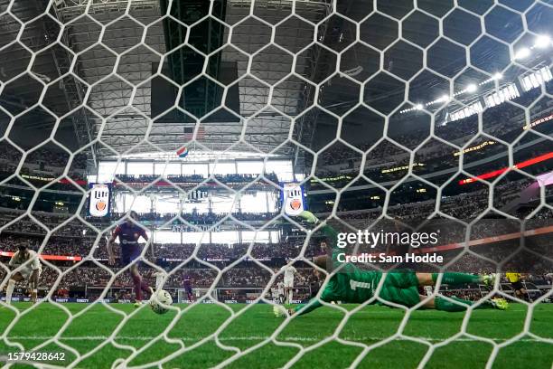 Marc-André ter Stegen of FC Barcelona dives to deflect a shot during the second half of the pre-season friendly match against Real Madrid at AT&T...