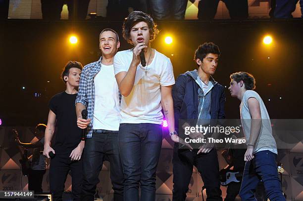 Louis Tomlinson, Liam Payne, Harry Styles, Zayn Malik and Niall Horan of One Direction perform onstage during Z100's Jingle Ball 2012, presented by...