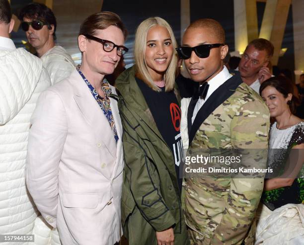 Helen Lasichanh and Pharrell Williams attend a party as Moncler Celebrates Its 60th Anniversary At Art Basel Miami Beach on December 7, 2012 in Miami...