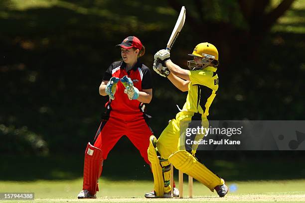 Nicole Bolton of the Fury bats as Scorpions keeper Tegan McPharlin looks on during the WNCL match between the Western Australia Fury and the South...