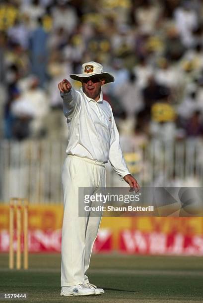 Captain Mark Taylor of Australia adjusts his fielders during the tour of Pakistan.