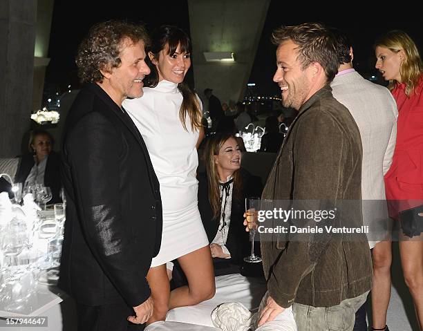 Renzo Rosso and guest attend a private dinner celebrating Remo Ruffini and Moncler's 60th Anniversary during Art Basel Miami Beach on December 7,...