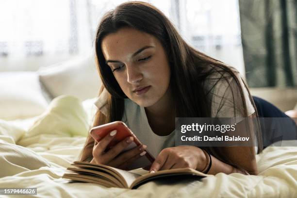 reading a book. homeschooling gen z girl. - z com stock pictures, royalty-free photos & images
