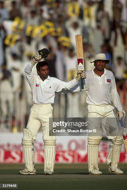 Saeed Anwar of Pakistan celebrates his century during the Test series against Australia.