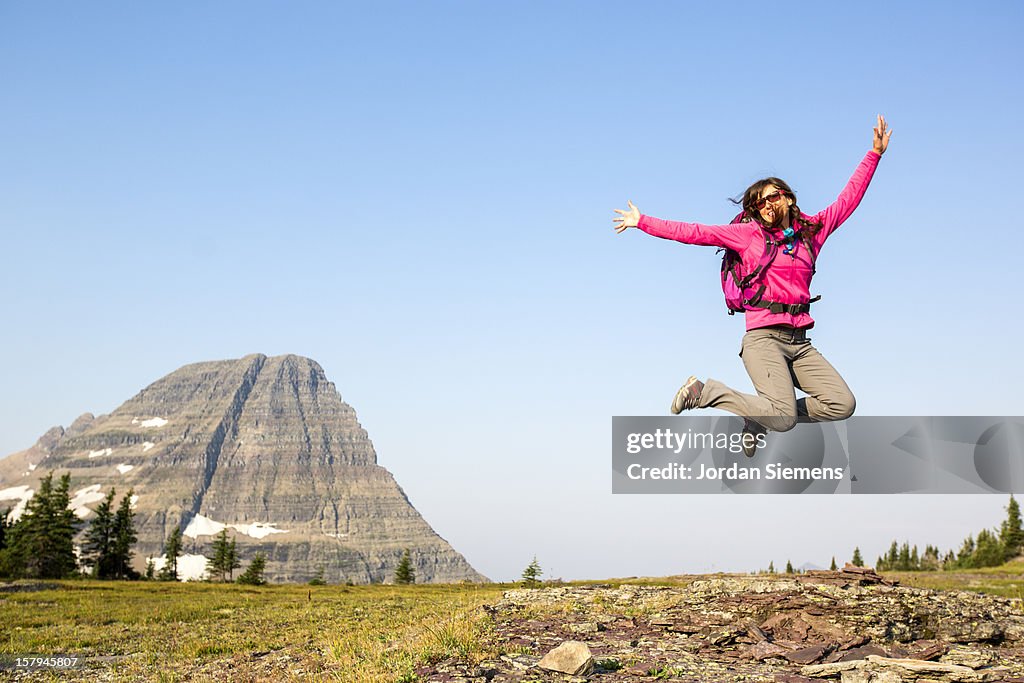 A female backpacking in the mountains.