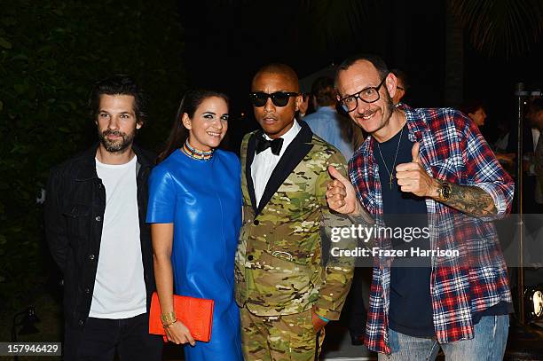 Photographer Terry Richardson and Pharrell Williams poses with guests at the OHWOW & HTC celebration of the release of "TERRYWOOD" at The Standard...