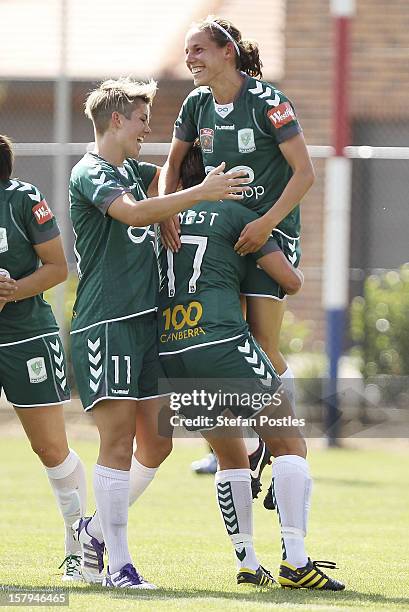 Nicole Sykes of Canberra United is lifted into the air after scoring a goal during the round eight W-League match between Canberra United and the...