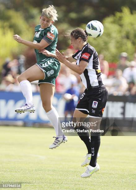 Michelle Heyman of Canberra United and Stacey Day of Newcastle Jets compete for a high ball during the round eight W-League match between Canberra...