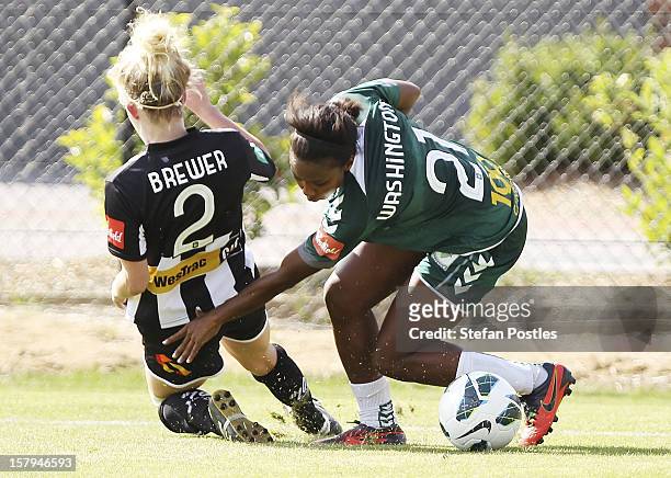 Madeline Washington of Canberra United and Hannah Brewer of Newcastle Jets contest possession during the round eight W-League match between Canberra...