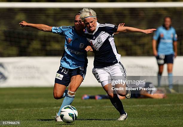 Emma Kete of Sydney and Jessica Fishlock of the Victory contest the ball during the round eight W-League match between the Melbourne Victory and...