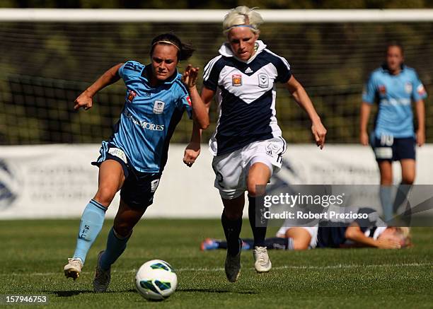 Emma Kete of Sydney and Jessica Fishlock of the Victory contest the ball during the round eight W-League match between the Melbourne Victory and...