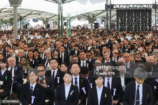 People attend the ceremony to mark the 78th anniversary of the world's first atomic bomb attack, at the Peace Memorial Park in Hiroshima on August 6,...