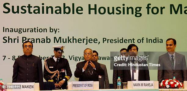 Indian President Pranab Mukherjee , Ajay Maken, Union Minister of Housing and Urban Poverty Alleviation , Navin M Raheja, President National Real...
